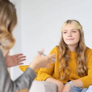 Therapist talking to client in a mental health clinic