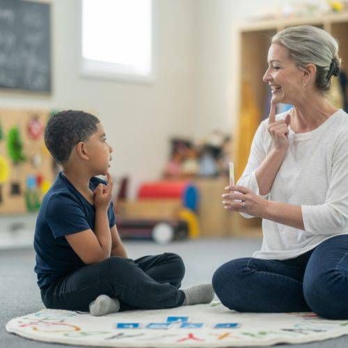 Image of therapist interacting with child | Dramatherapy or Drama Therapy | The Purple House Clinic Leicester