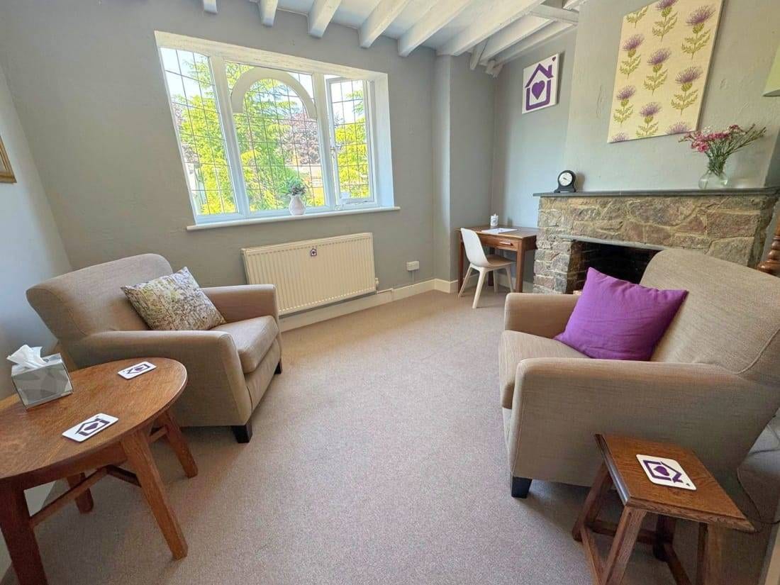 A calm, homely therapy room at Purple House Clinic Woodhouse Eaves, located a short drive from Loughborough, Coalville, and Shepshed.