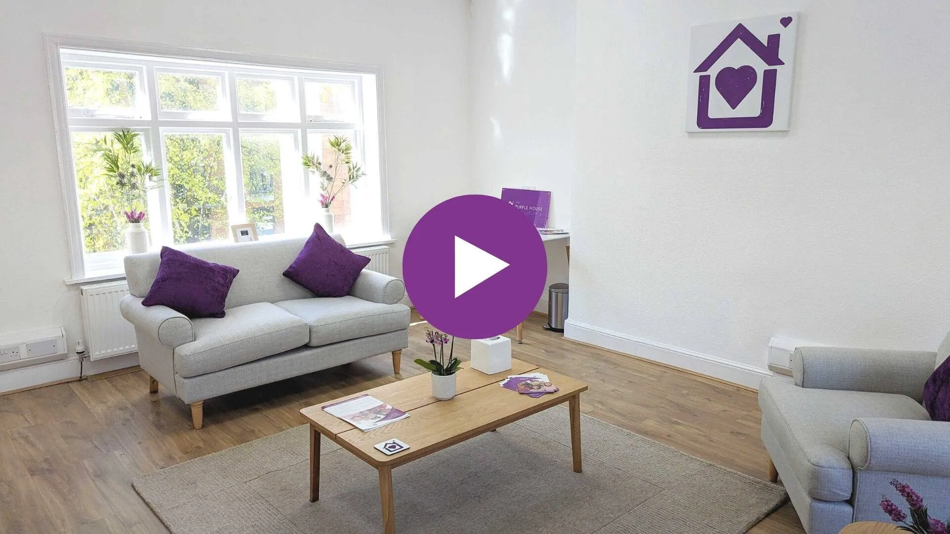 A warm and inviting clinic room at the Purple House Clinic Nottingham, featuring comfortable seating and natural light.